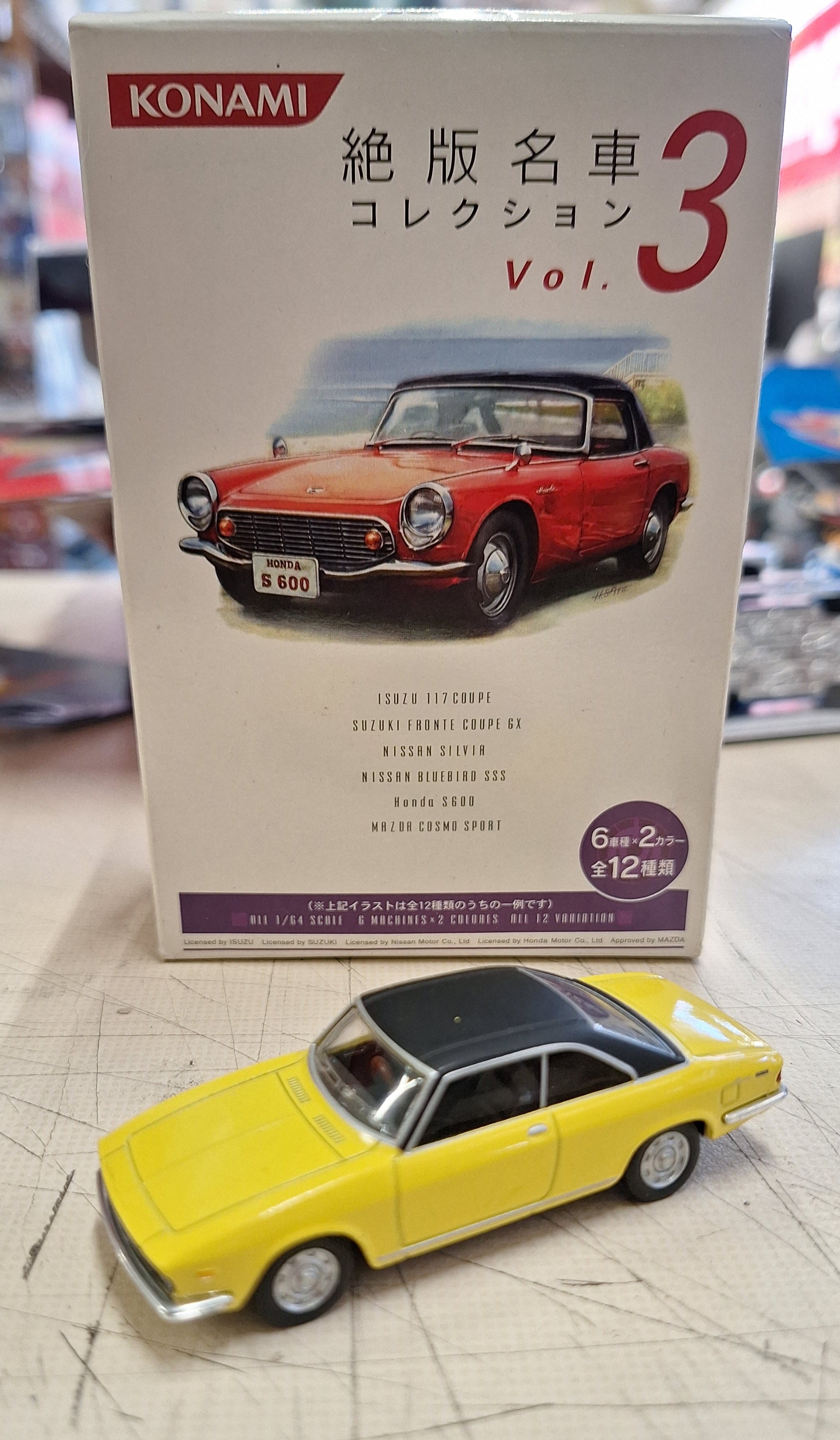 Konami 1:64 Isuzu 117 Coupe PA90 Yellow – Frankton Model Shop